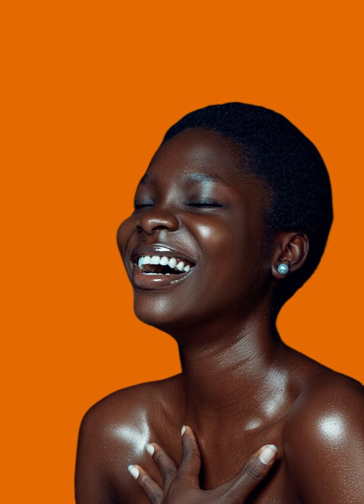 Woman laughing with eyes closed