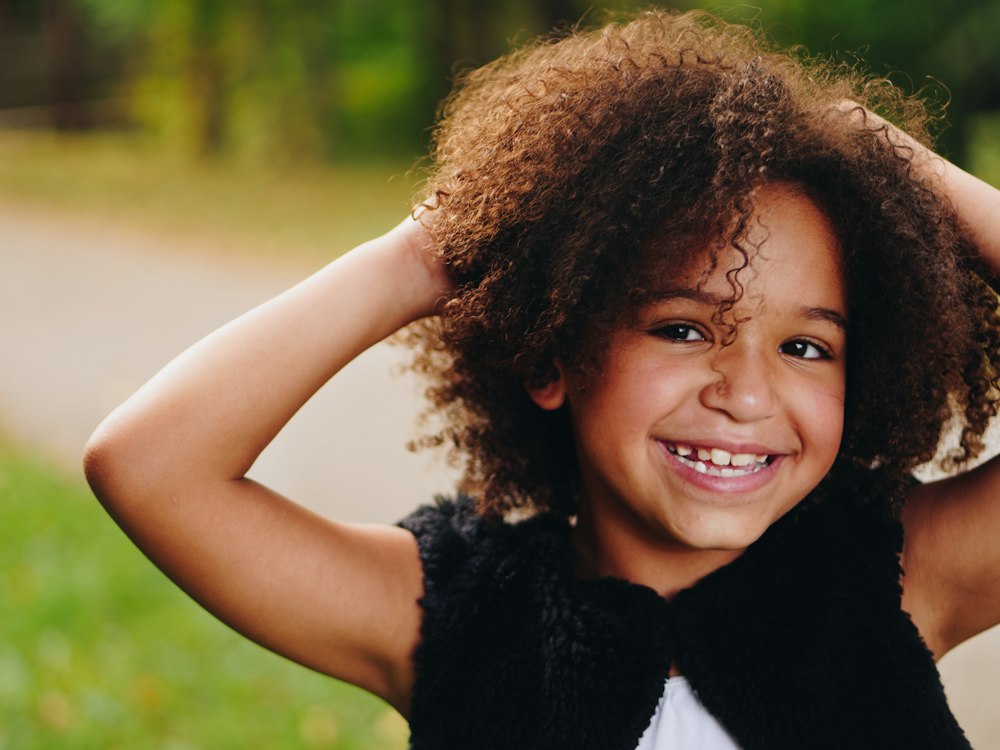 Smiling girl with curly hair